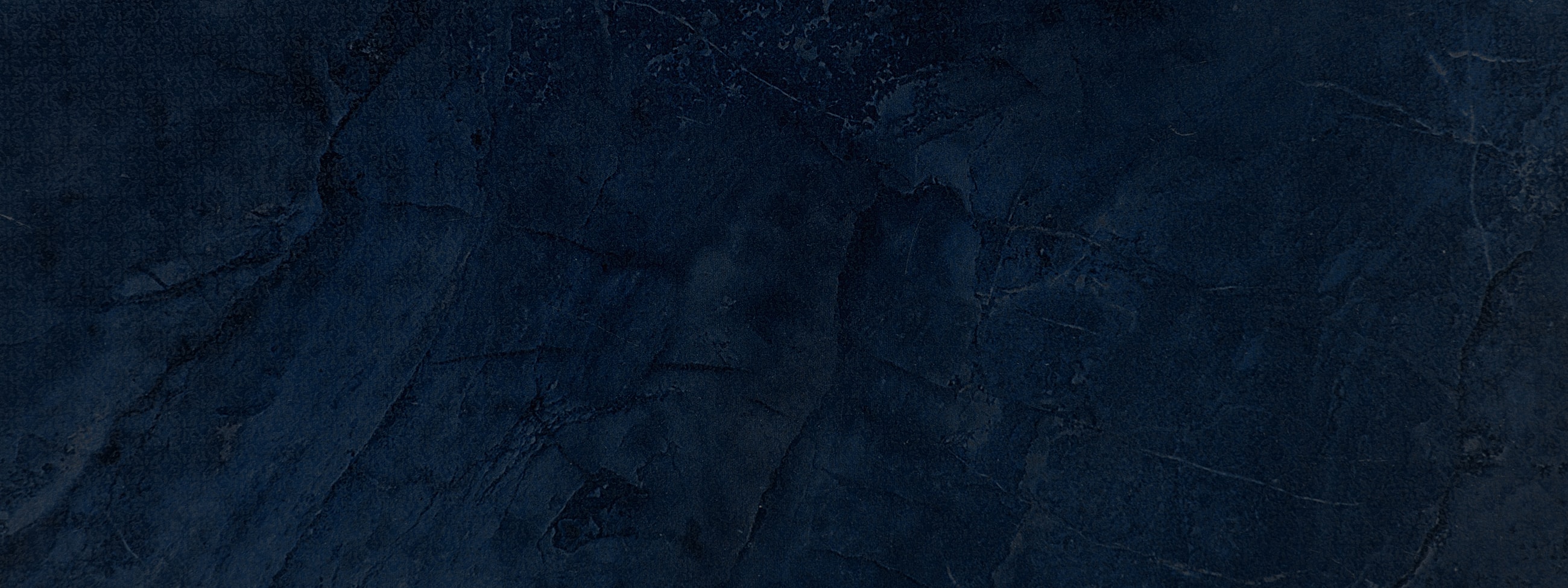 Dark textured background with deep blue tones.
