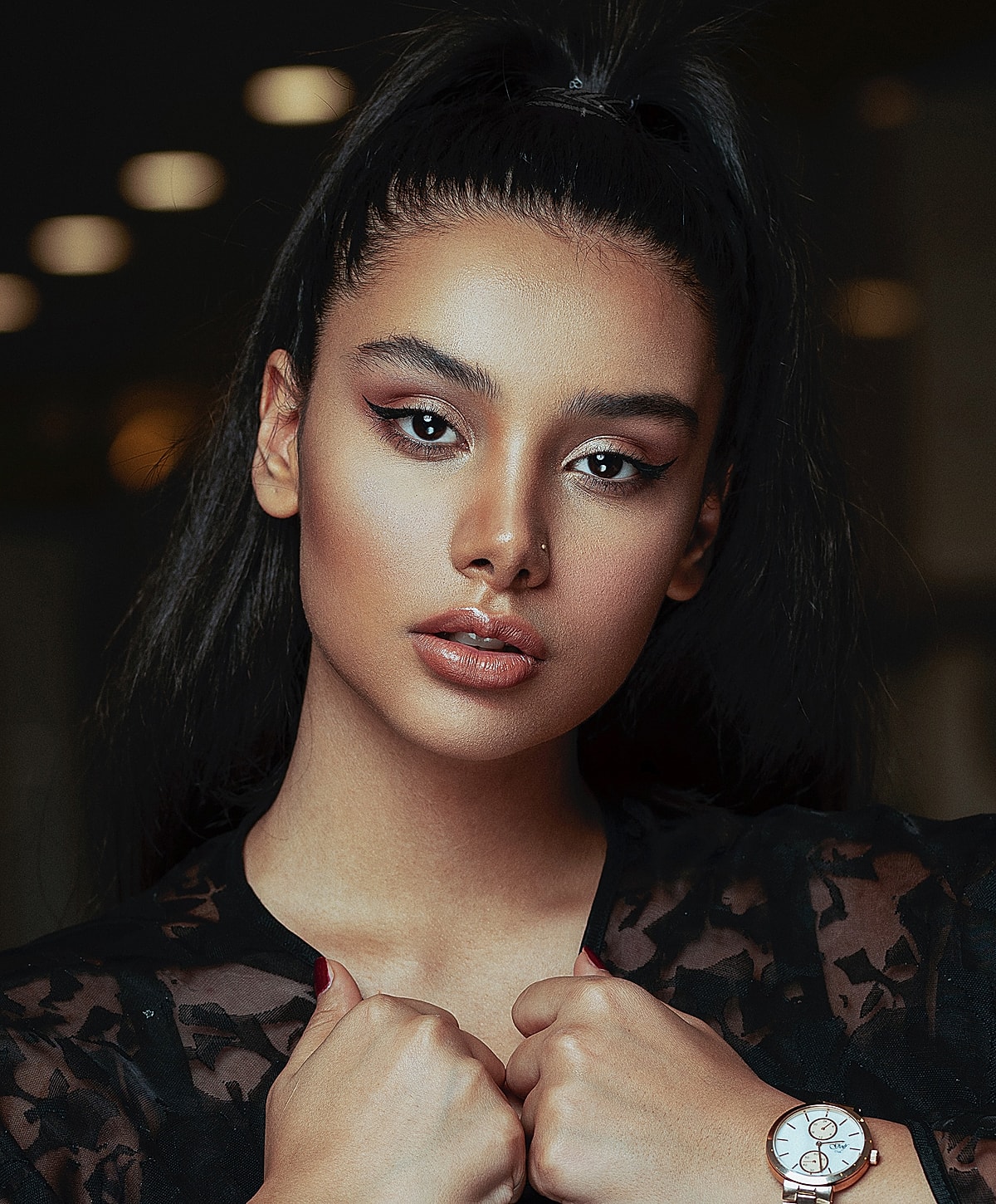 Portrait of a woman with sleek hairstyle and makeup